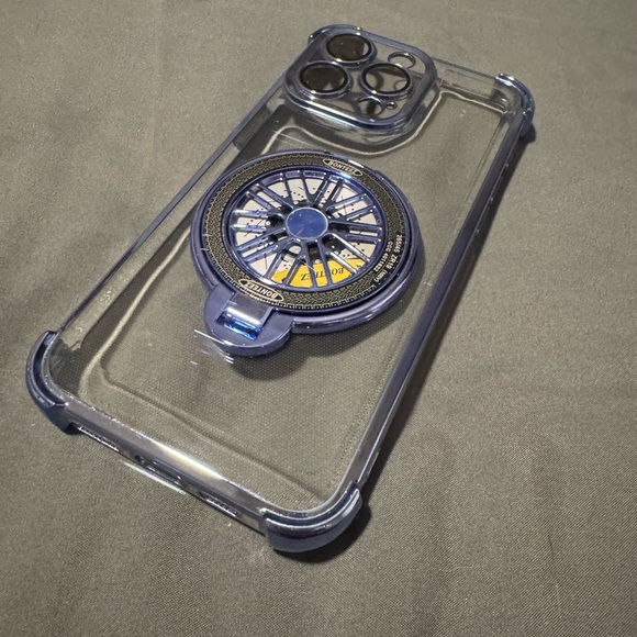 Other - Clear Phone Case with Blue Accents For a 15 Pro Max. Spinning wheel in Center.